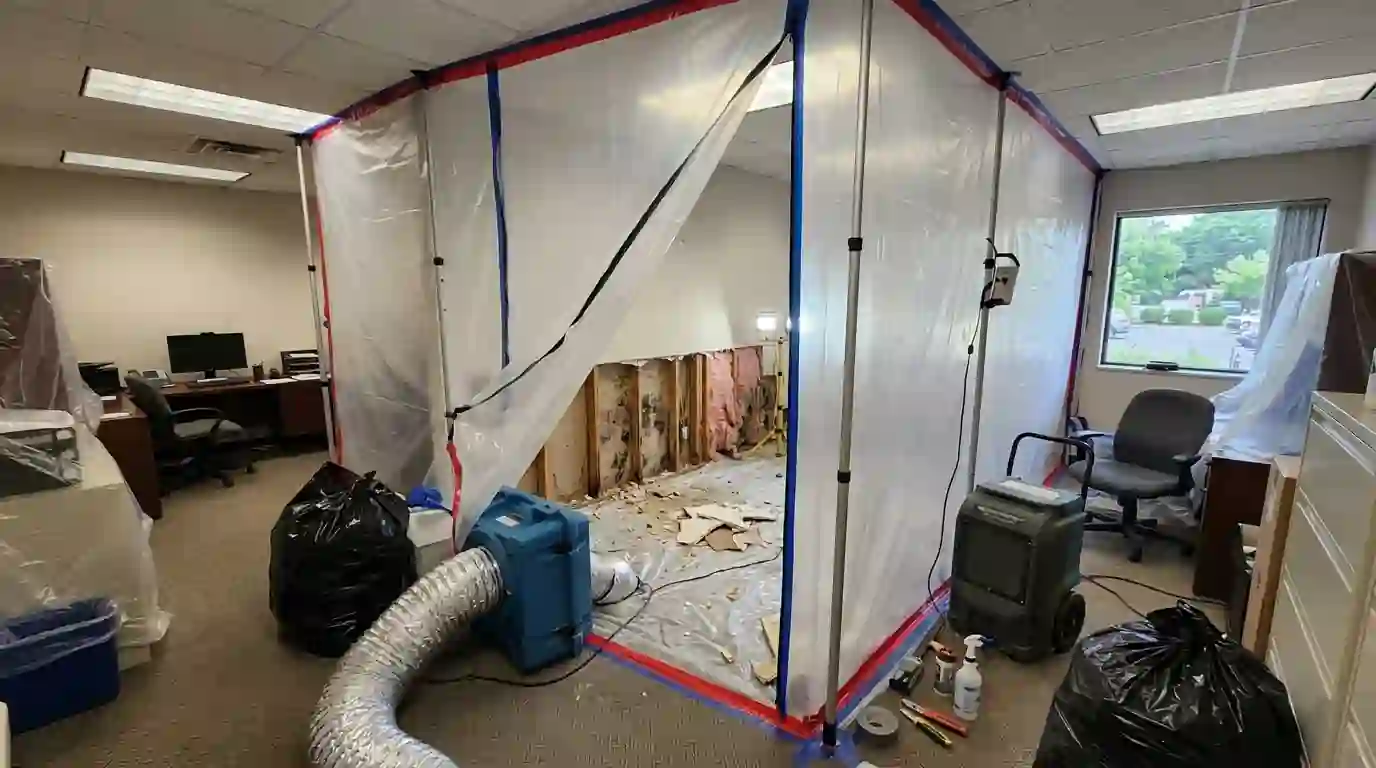 Opened office wall inside containment after a leak