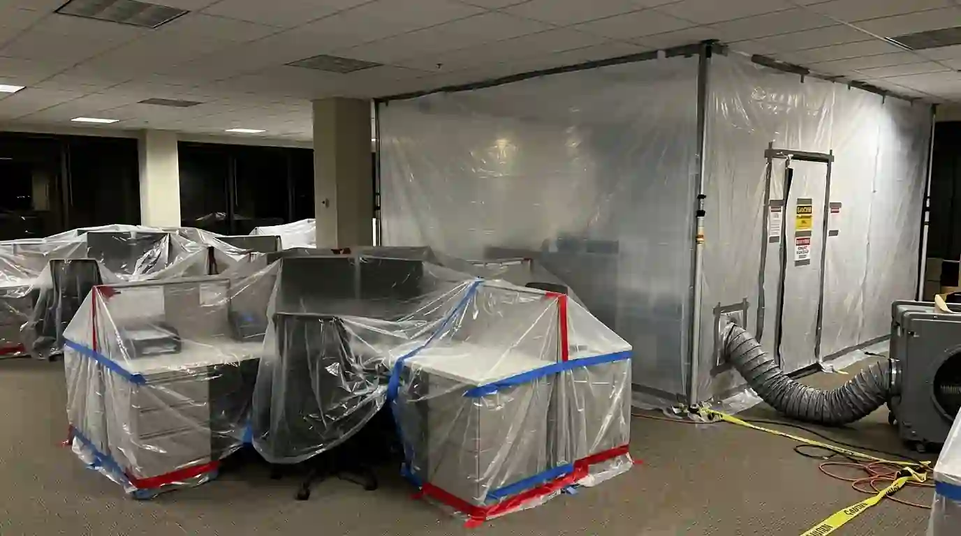 Covered workstations beside a sealed containment zone
