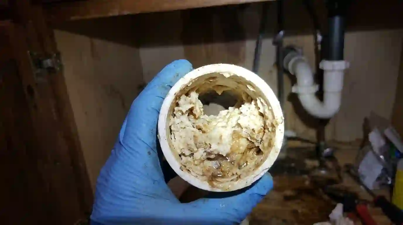 Pipe section narrowed by hardened grease